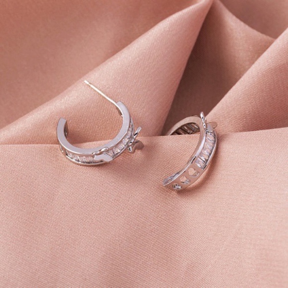 Butterfly c-shaped silver copper hoop earrings.
